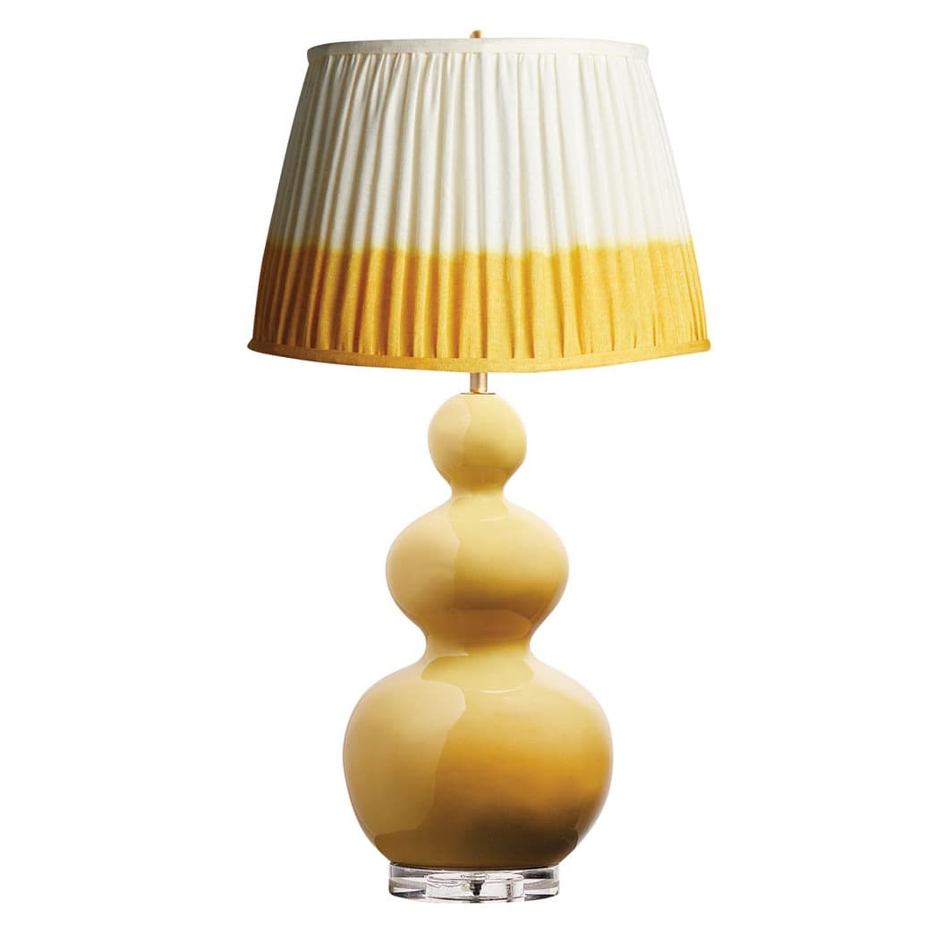 table lamp with a yellow bulbous base and a pleated yellow and white shade