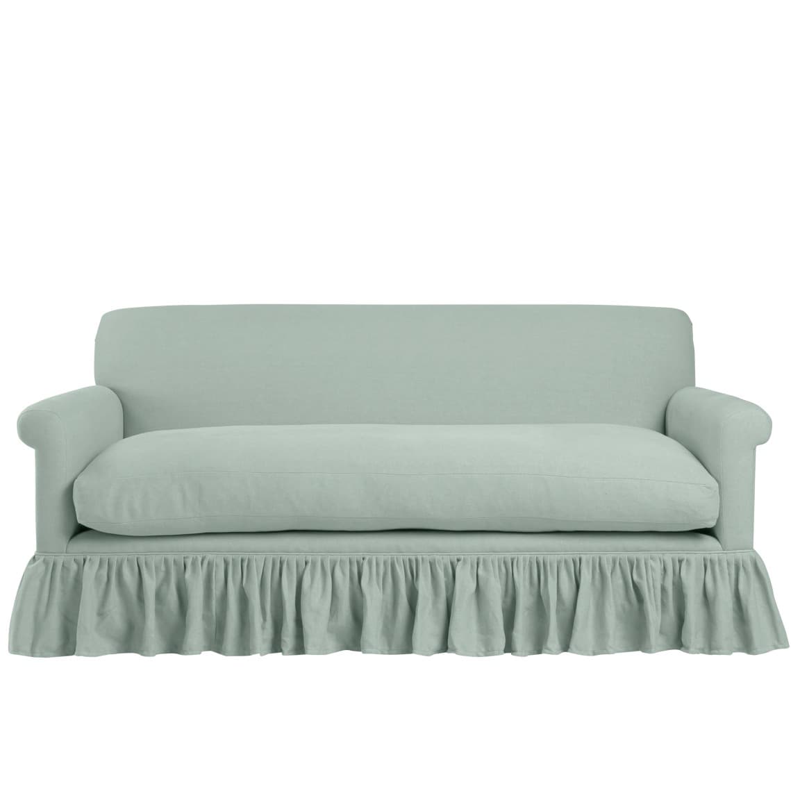 sage green linen sofa with a ruffled bottom