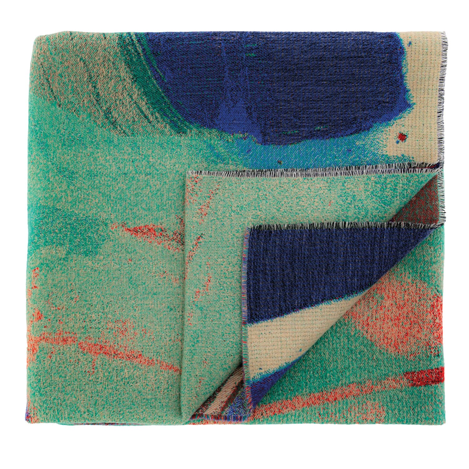 A folded textile featuring an abstract design with green, blue, and red hues. The overlapping layers add depth and texture, conveying a vibrant, artistic tone.
