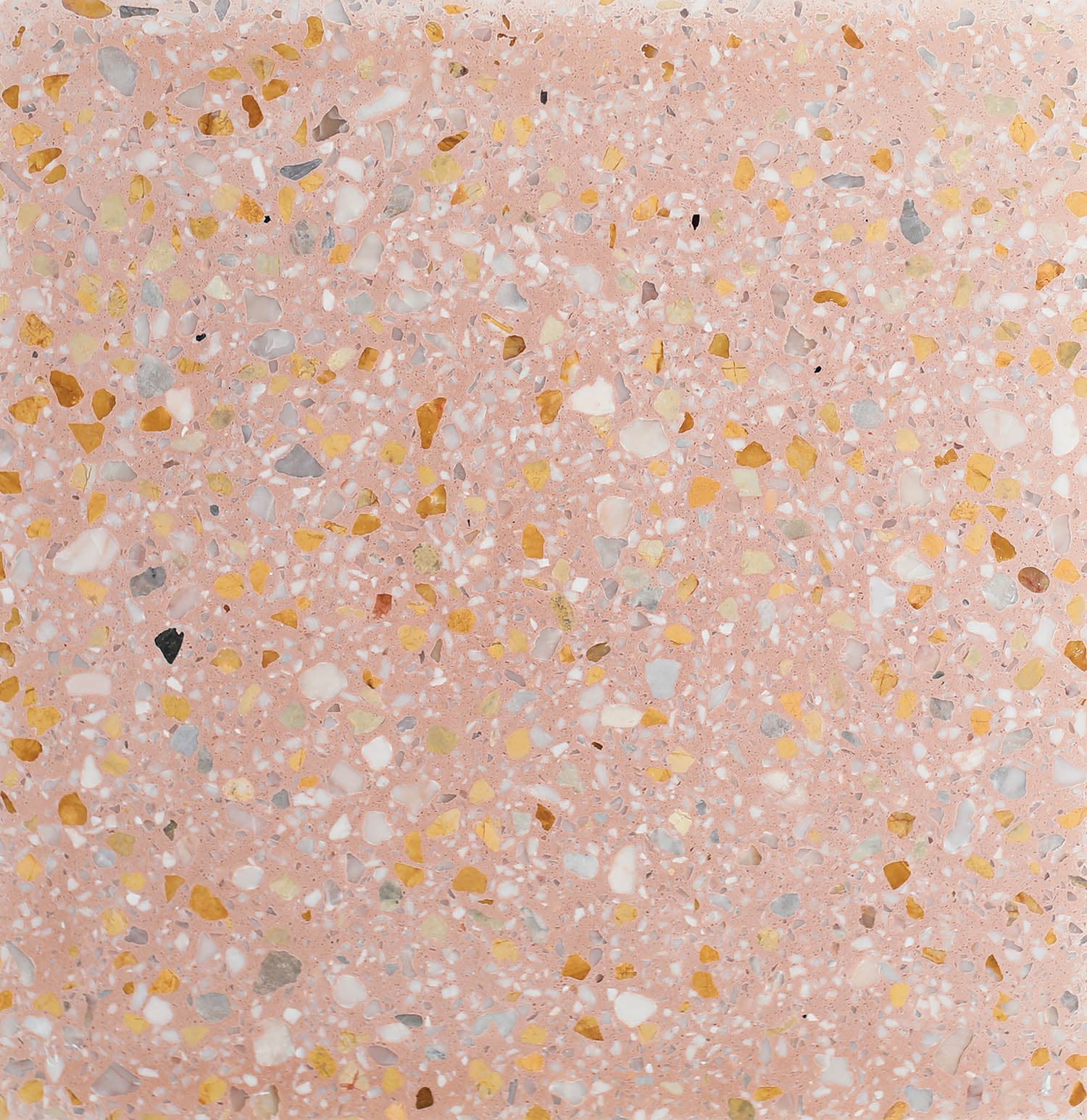 Pink terrazzo surface with a mix of white, yellow, gray, and black chips
