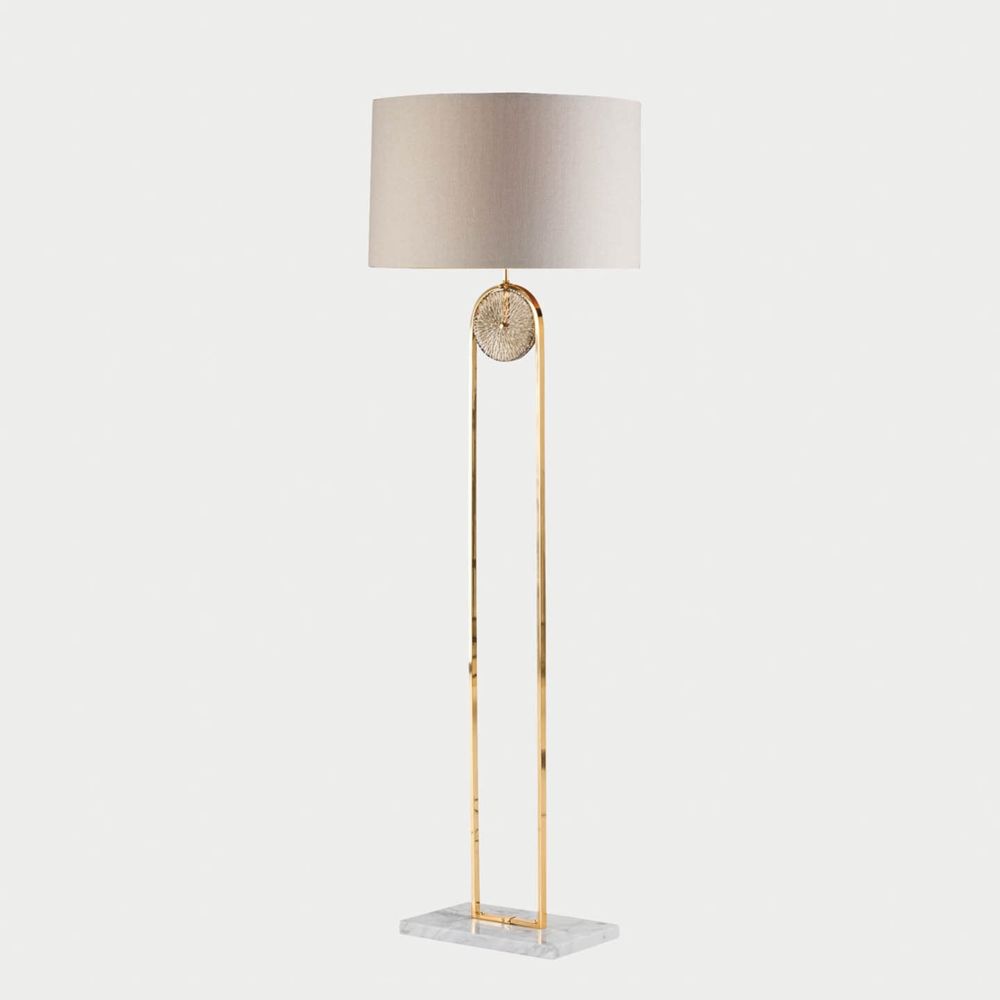 floor lamp with a marble base, gold stand and white cylindrical shade
