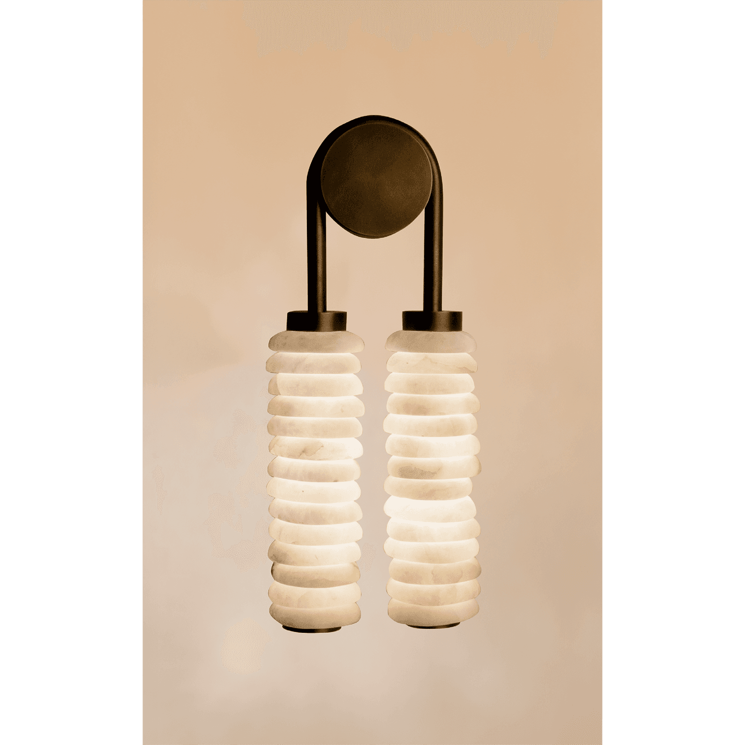 A sconce with two matching cylindrical lights set side by side.