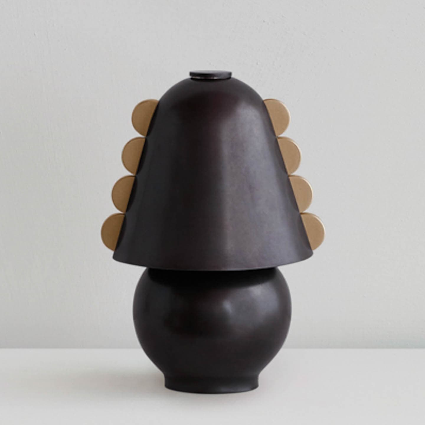 Brass table lamp with scalloped edges along the shade