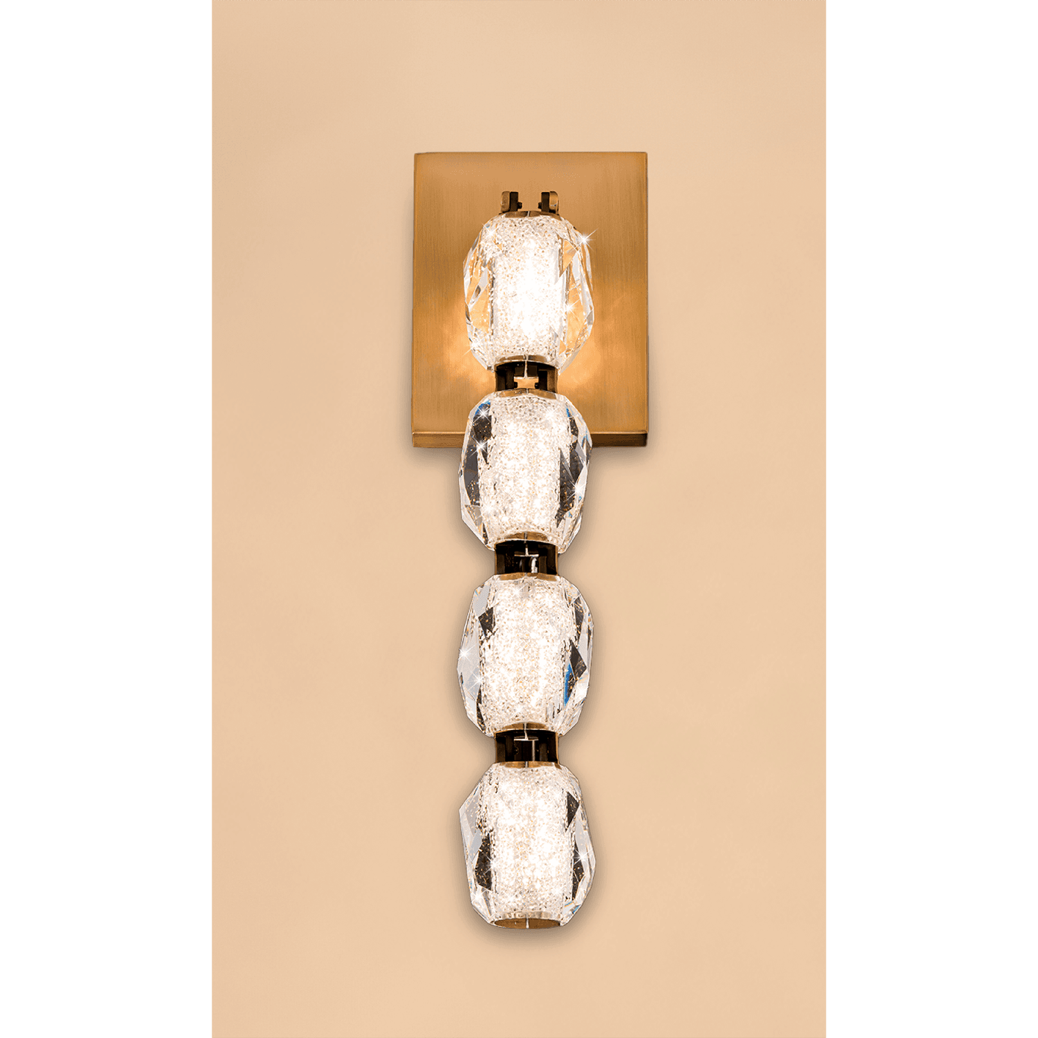 A wall sconce with a square base and four descending oval-shaped lights.