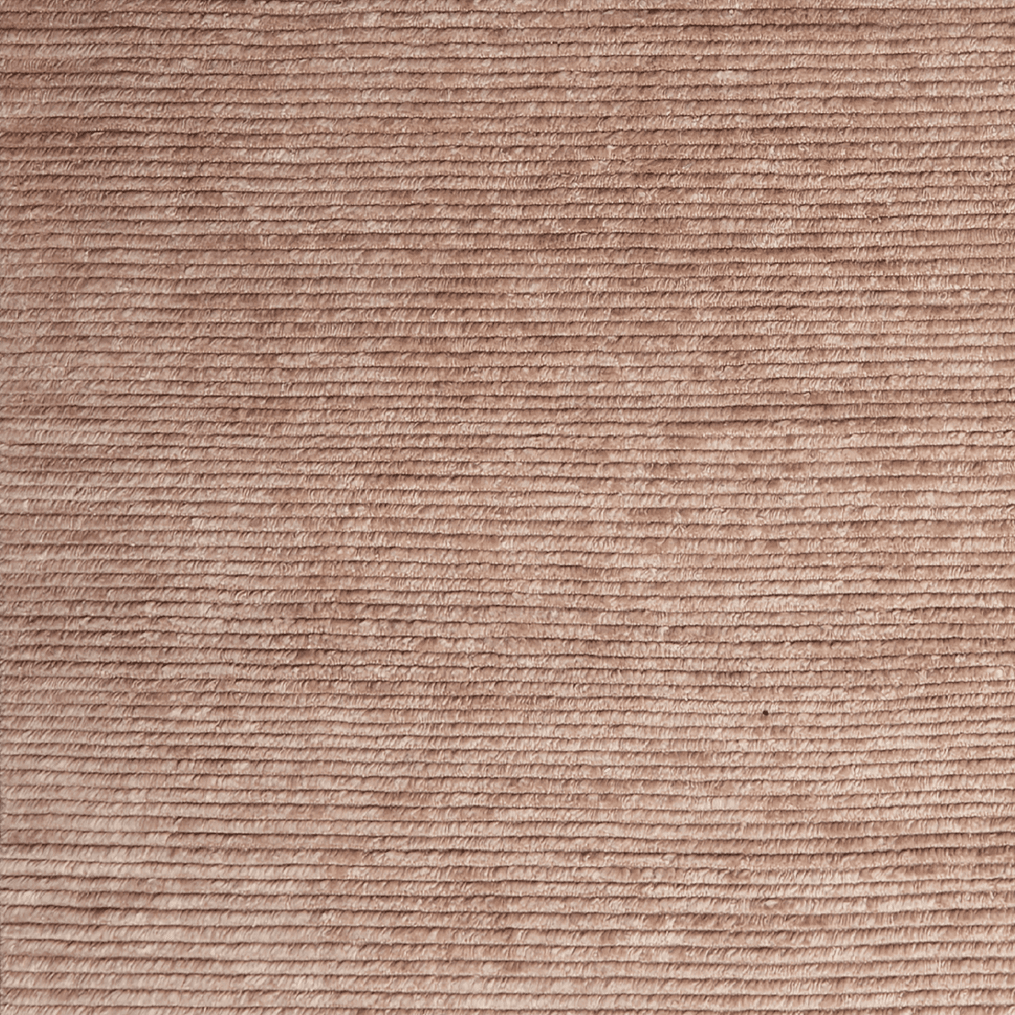 blush-colored woven rug