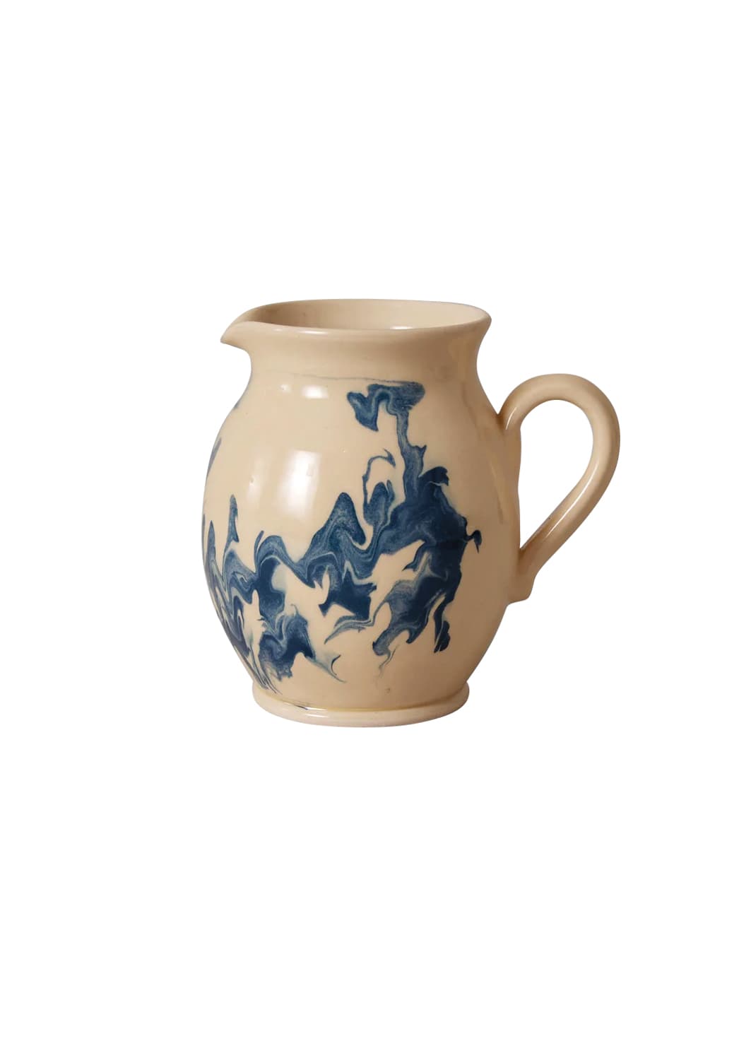 Cream ceramic pitcher with blue marbled swirls by Poterie Barbotine.
