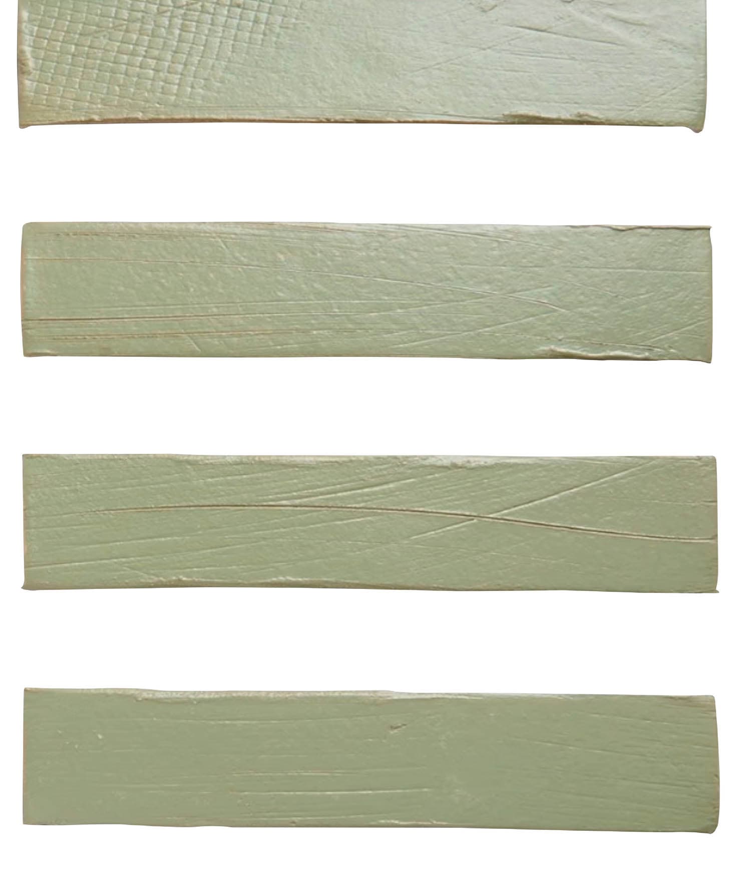 a stack of four green tiles