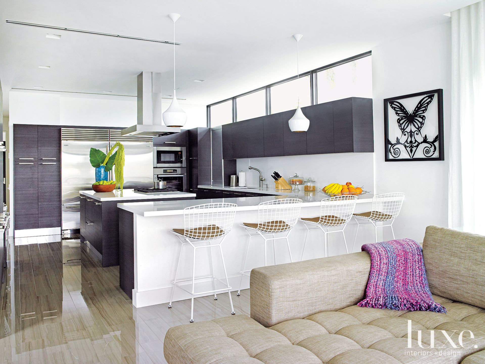 all black and white cabinets with white barstools