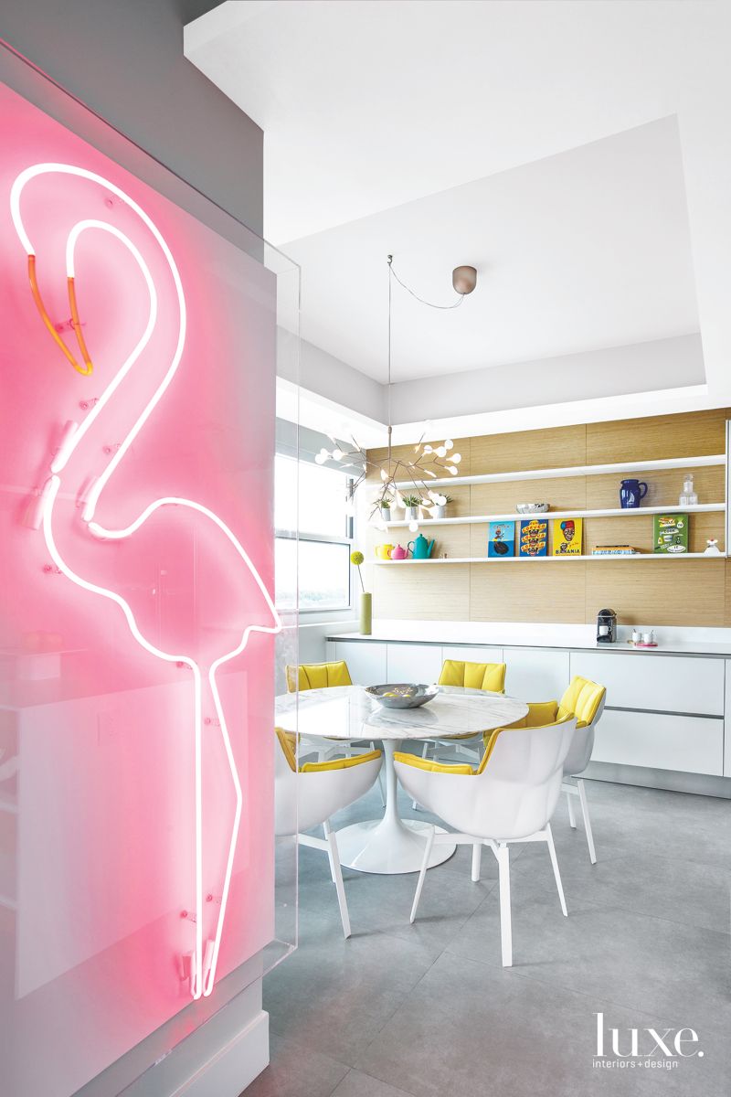 break room with shelves and neon pink flamingo light