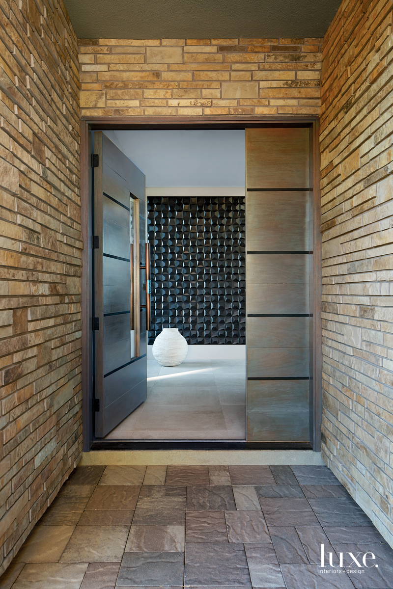 contemporary entryway mosaic-like black tile...