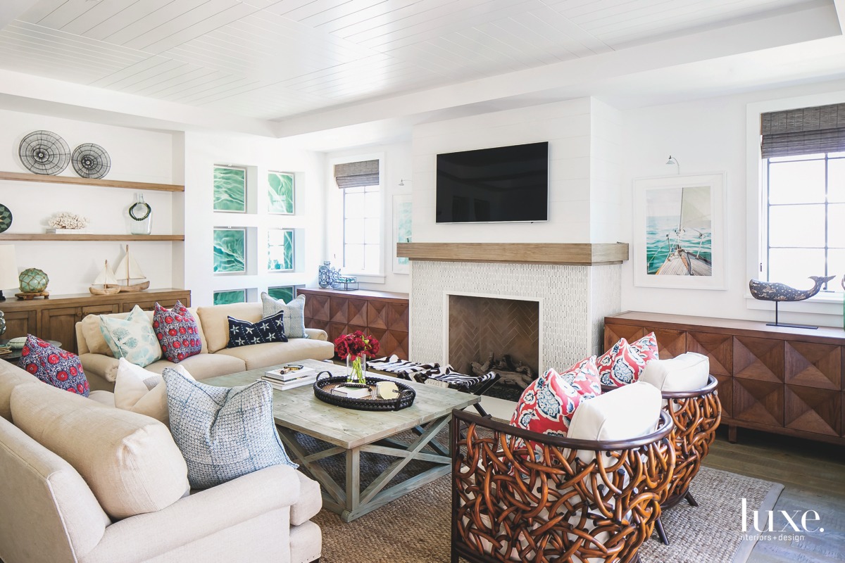coastal living room fireplace linen-covered...