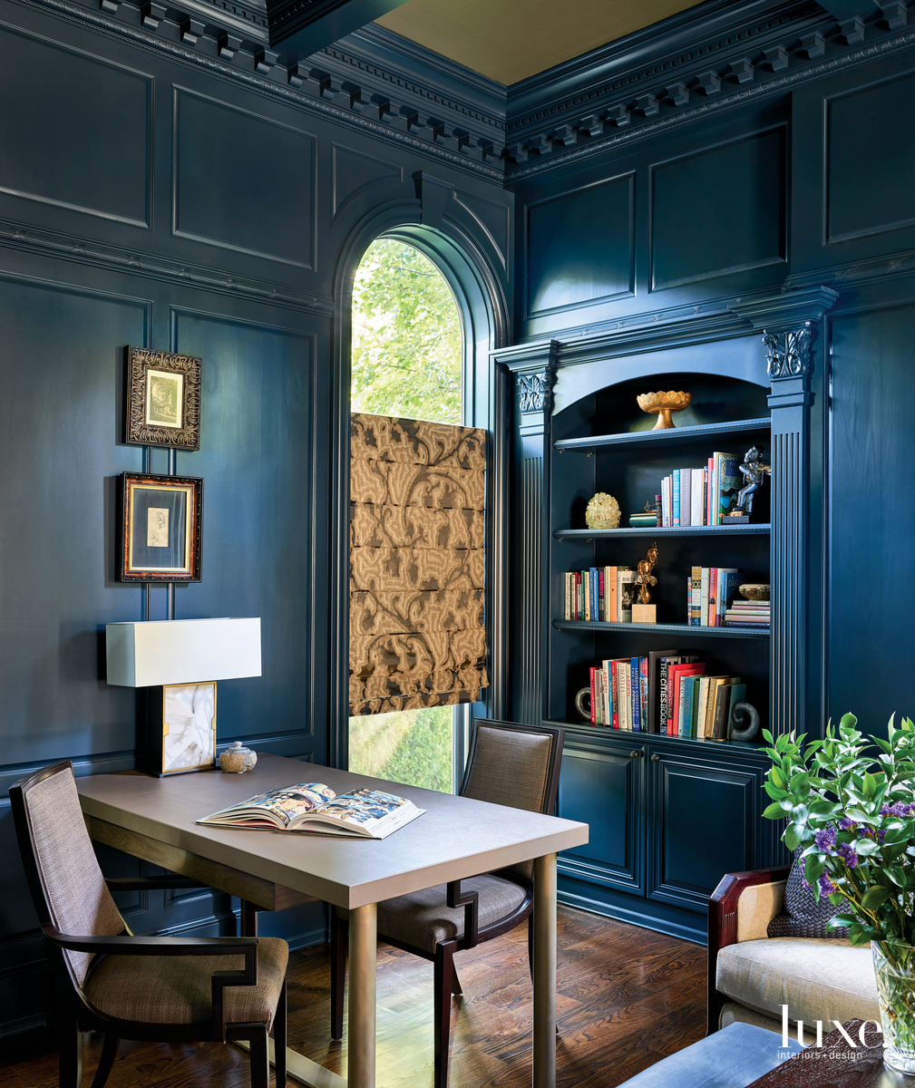 transitional office with navy walls...
