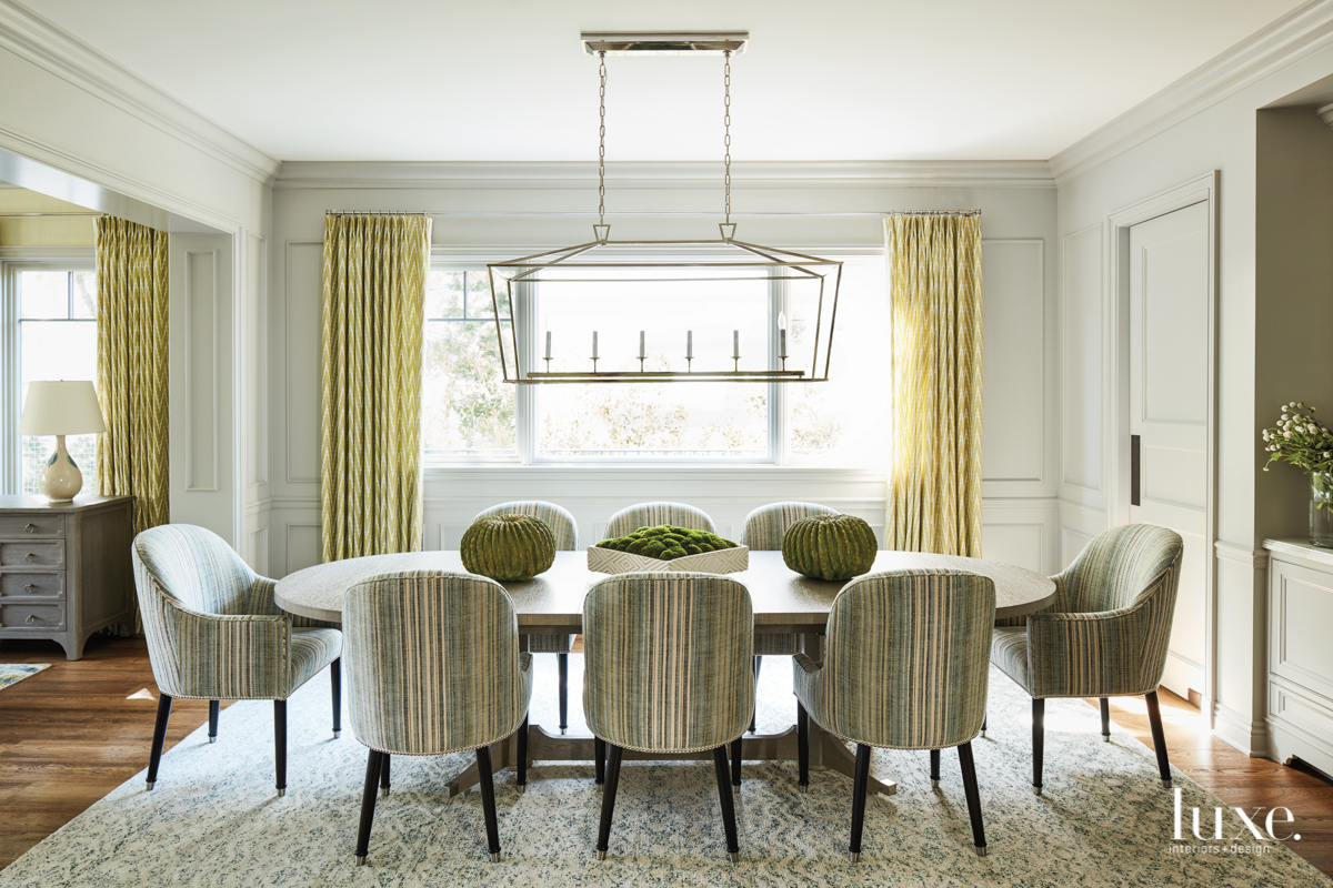 transitional green dining room in...
