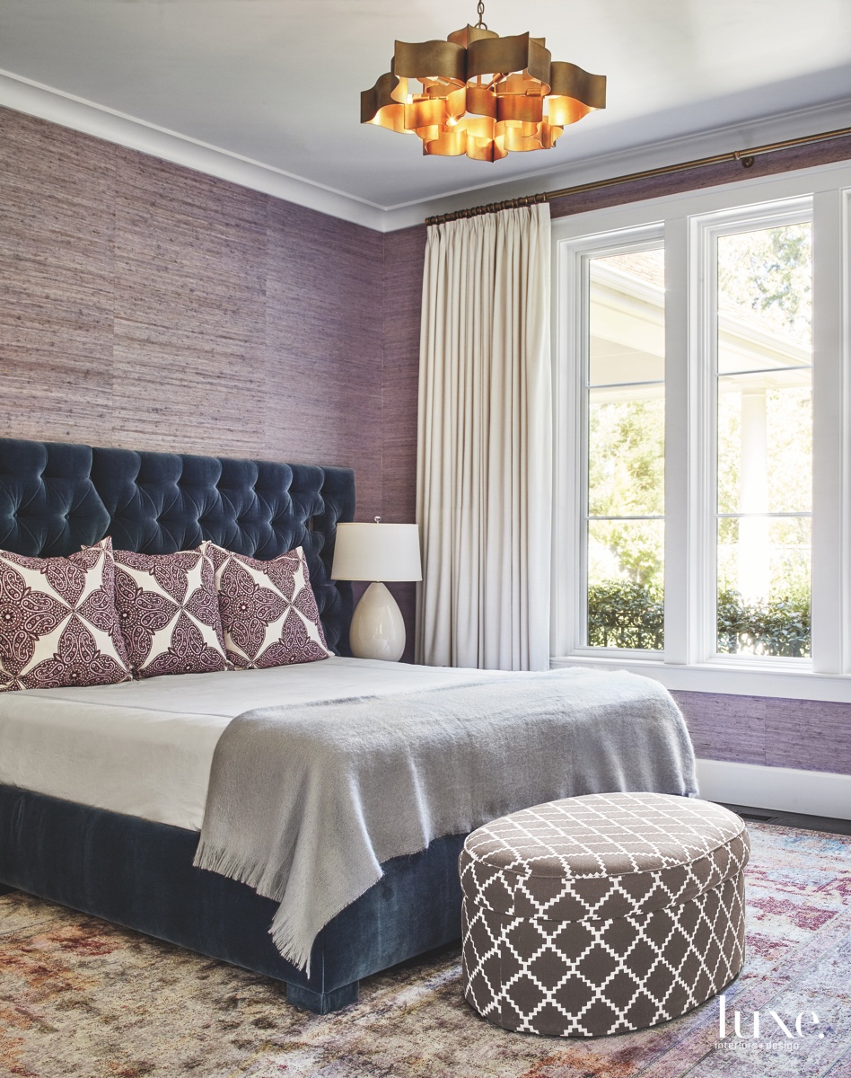 transitional bedroom purple accents ottoman...