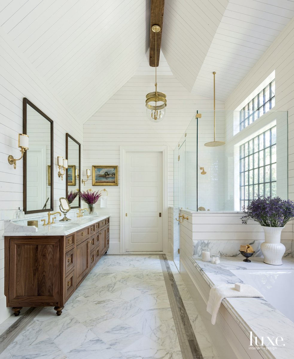 traditional white bathroom wood cabinetry...