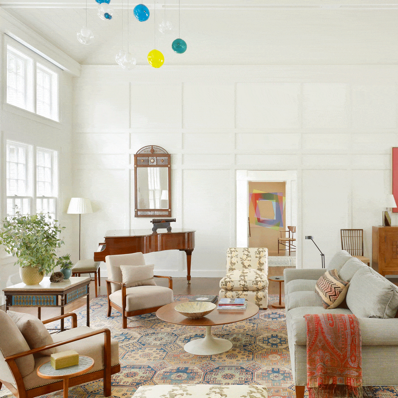 This living room on Long land, with a high beamed ceiling supported by regularly paneled walls, is a modern interpretation of the classical tradition.