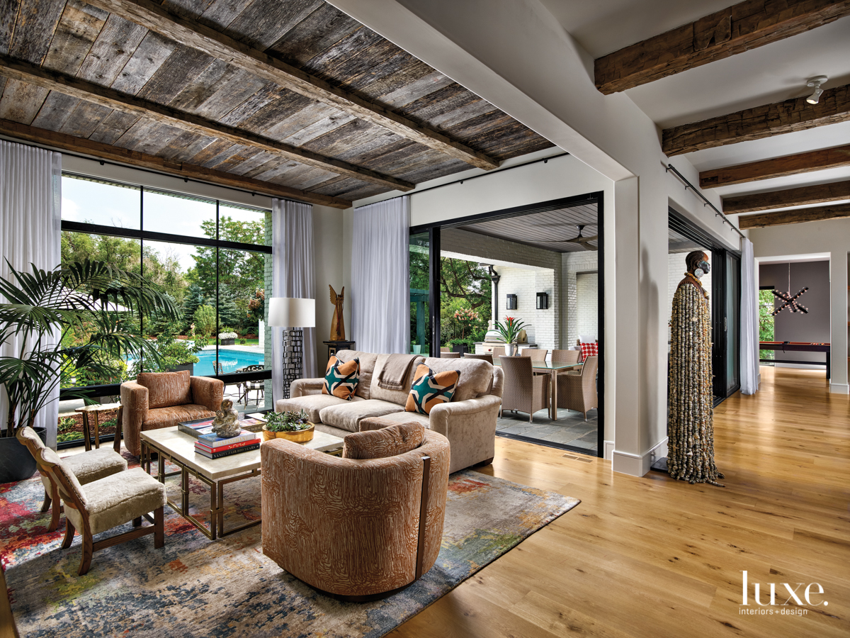 transitional living room neutral palette wooden ceiling