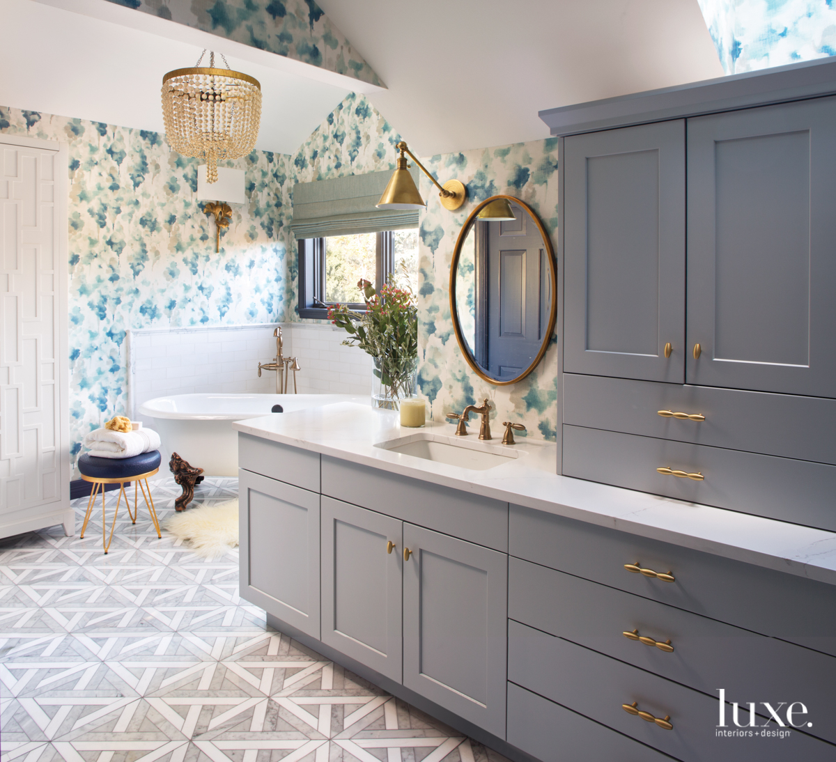 transitional bathroom gray cabinetry blue accents