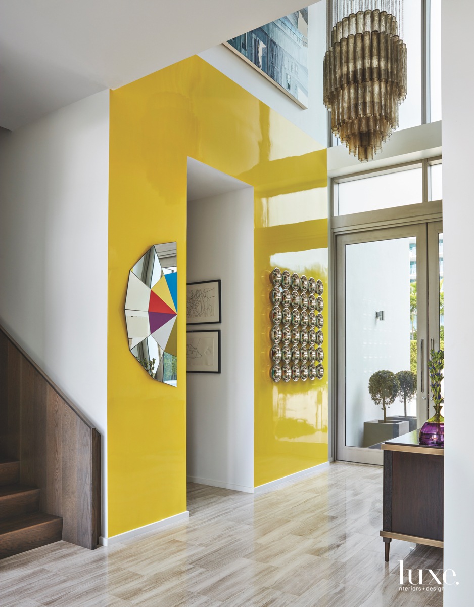 contemporary entry mirror artwork bold citron yellow wall