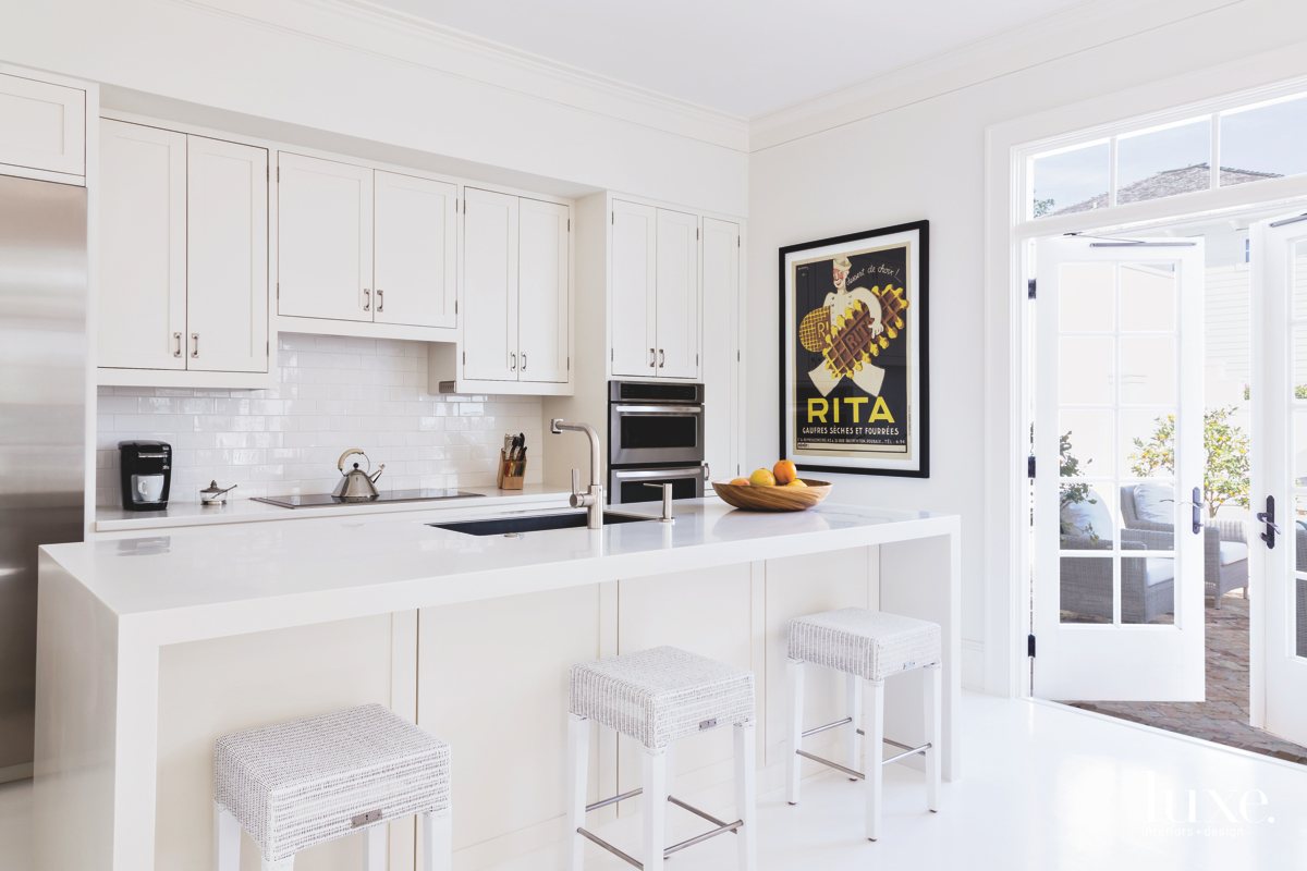contemporary white kitchen with subway...