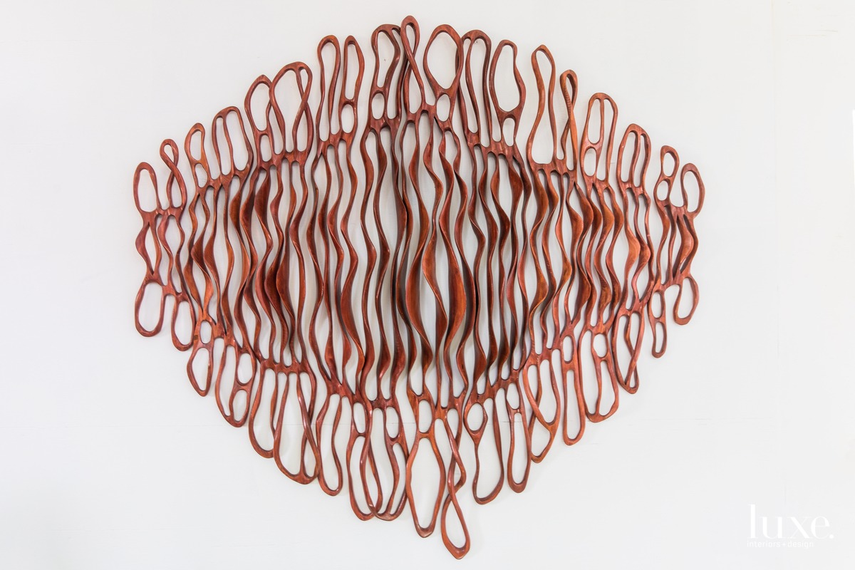 red curvy wall sculpture