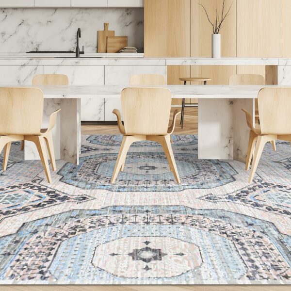 A modern dining room with a large blue and white patterned rug.