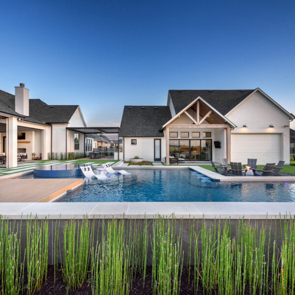 backyard view of home with pool by aquaterra