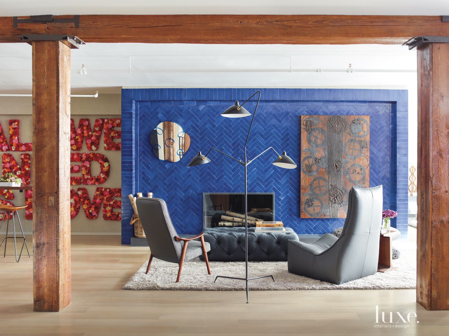 eclectic living room with blue wall and fireplace