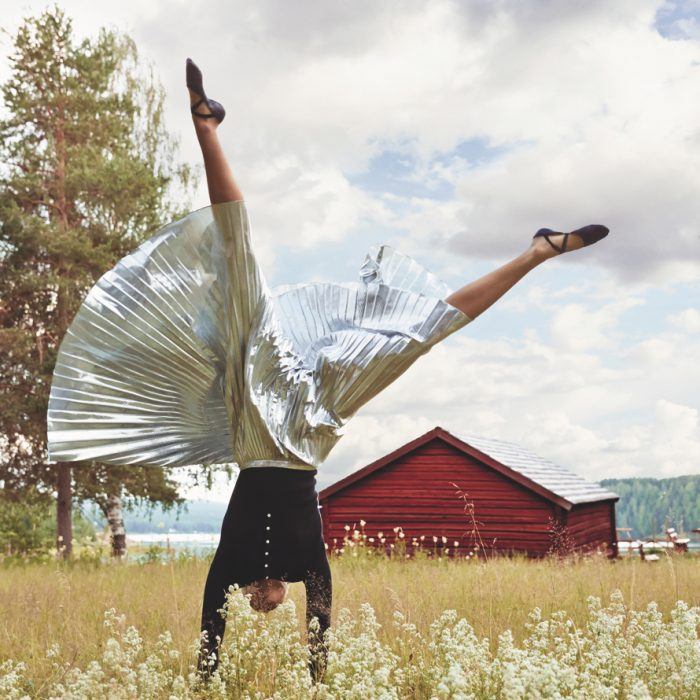 THE HILLS ARE ALIVEIn Edefors, an idyllic field of wildflowers makes an exquisite picnic spot close to the river. Citizens of Humanity thermal top. DKNY pleated skirt. Capezio leather ballet slippers.