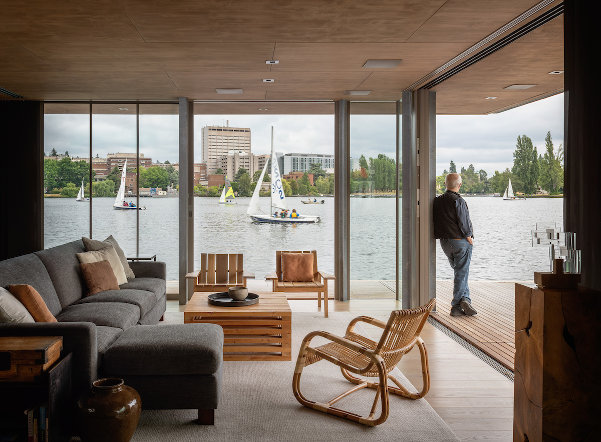 Home on water with wall to wall windows.