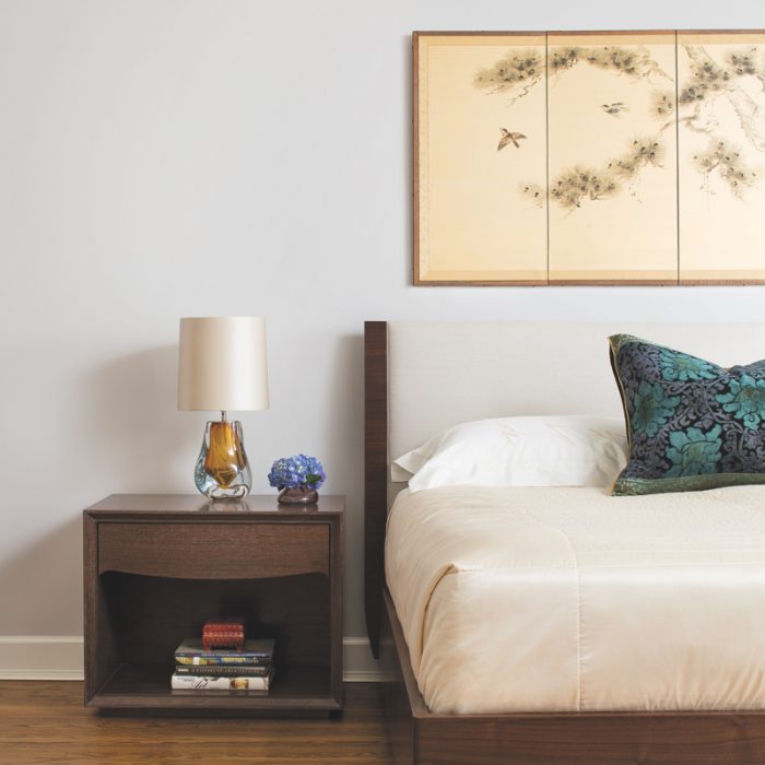 asian inspired minimalist bedroom with wood nightstand