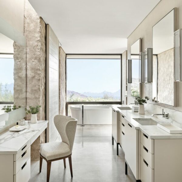 An Arizona Home With Panoramic Vistas Lets Nature Take Center Stage In the airy, open master bath, Biegner’s layout achieves a sense of privacy without sacrificing views. The Duravit bathtub and double vanity and the upholstered Kerry Joyce side chair contribute to the sleek, modern aesthetic.