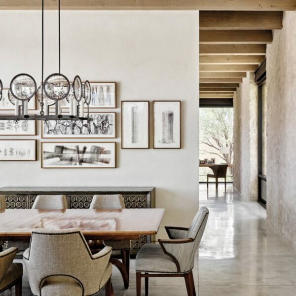 An Arizona Home With Panoramic Vistas Lets Nature Take Center Stage â€¨Gregorius Pineo armchairs surround a Rose Tarlow walnut table in the dining area, which is connected to the living area and straddles the line between modern and traditional design. "It has a transitional attitude and provides an informal ambience to dinner parties and family gatherings," says Miller.