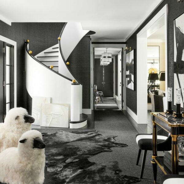 Classic Principles Take On A Funky Spin In A Bold Home Near Lake Michigan foyer black lacquered grass cloth with winding staircase
