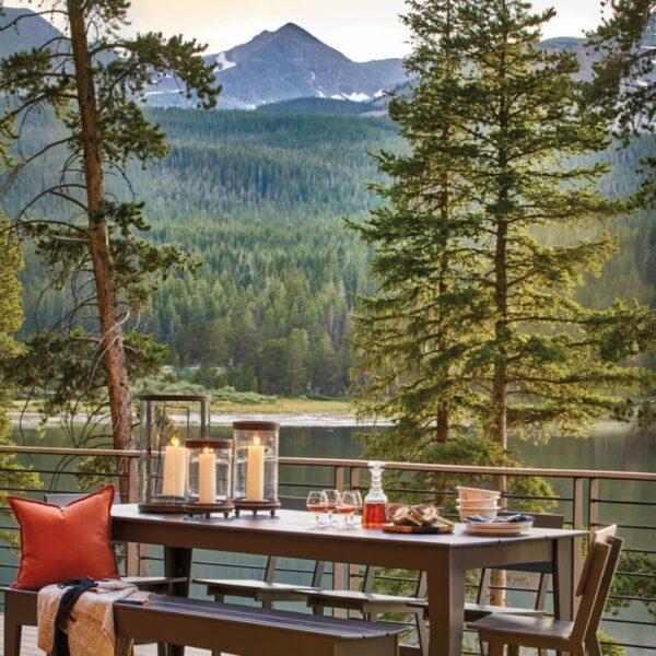 Kick Back And Relax At This Lakeside Retreat Amid The Rockies outdoor dining table and chairs amid pines