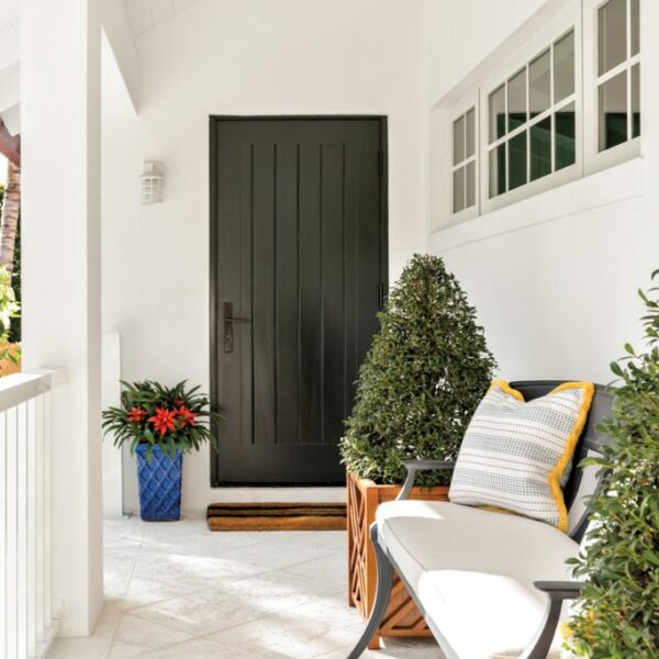 The Cheery Palm Beach Vacation Home You’ll Want To Winter In black door entry porch