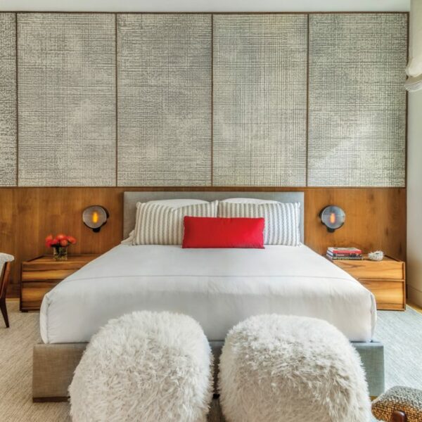 A 15-Page Survey Yields A Design That Fully Embraces This Couple’s Heritage The in-law suite is designed as a retreat for the homeowners’ parents. A Weitzner wallcovering is reminiscent of Japanese washi paper and makes for a dynamic backdrop. A pair of Fallon sconces by Caste Design purchased through De Sousa Hughes hang above walnut nightstands by Joel Dupras. The Coup Studio armchairs and poufs are from Coup D’Etat.