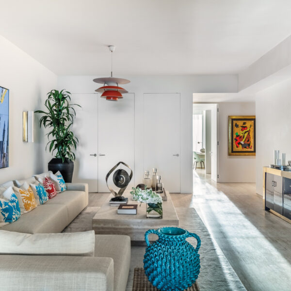 Colorful Art, Textural Accents Bring Vibrancy To A Miami Vacation Home media room with minotti sectional and pops of color
