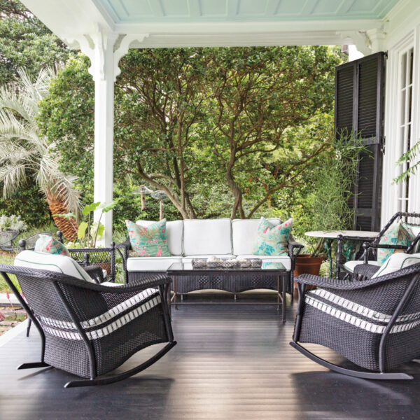 Layered Interiors Perfect A Gorgeously Restored South Carolina Home porch with black wicker furniture