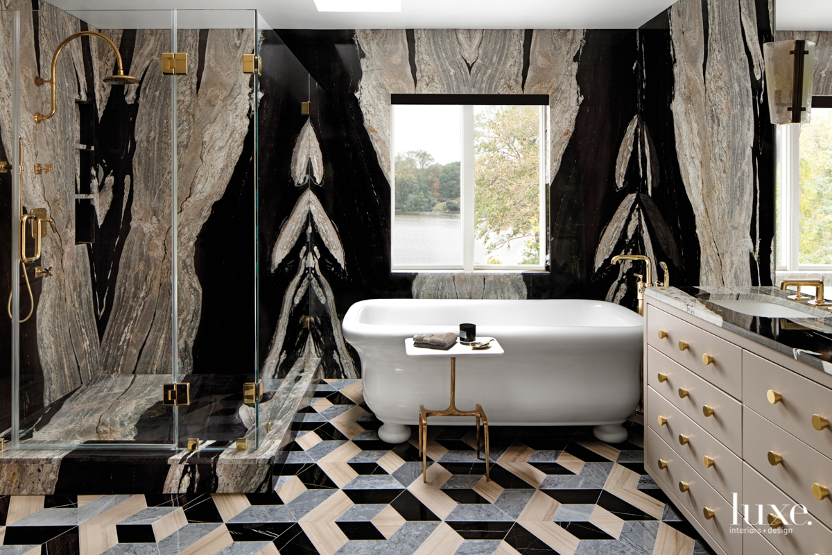 black horse marble slabs master bathroom with soaking tub