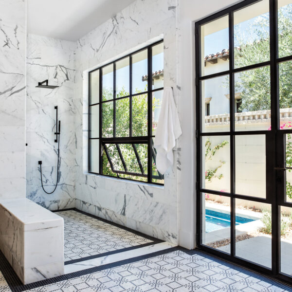 Warmth, Character And Surprise Accents Elevate This California Family Retreat calacatta marble and basait mosaic tiles master bathroom