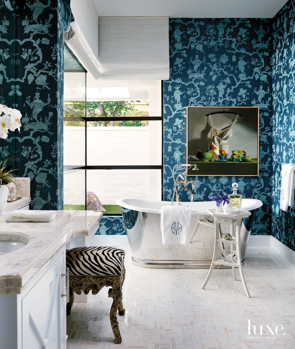 Rancho Mirage master bath with blue chinoiserie pattern wallpaper and metal freestanding tub