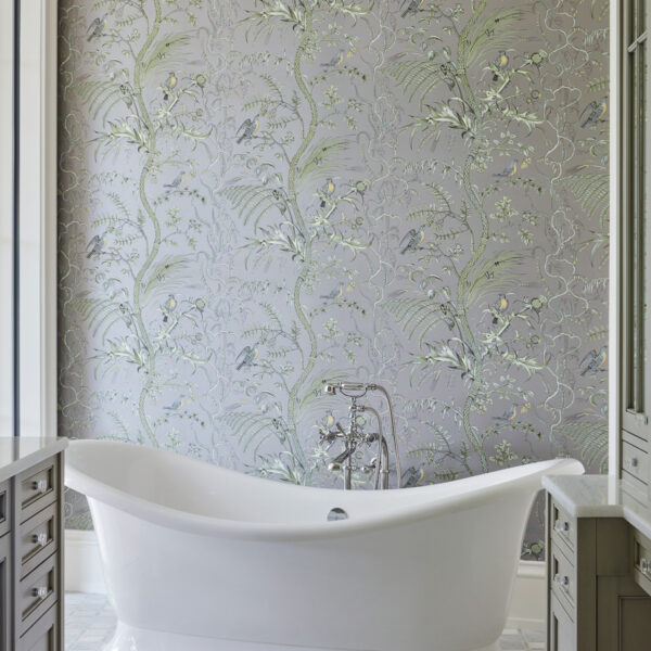 A Breezy Lanai Makes It Easy To Embrace Year-Round Sunshine master bathroom victoria + albert tub and silver wallcovering