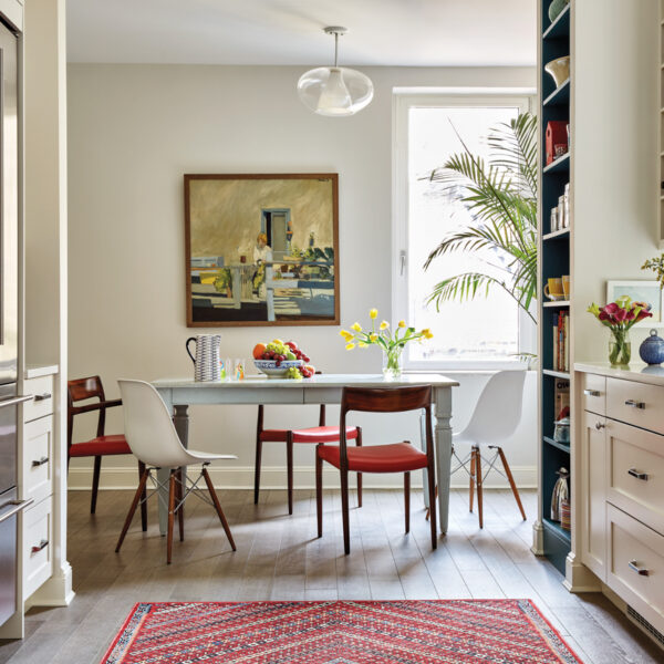 A Spunky Color Story Elevates A PreWar Duplex With Old New York Charm breakfast table with vintage eames and niels otto moller dining chairs
