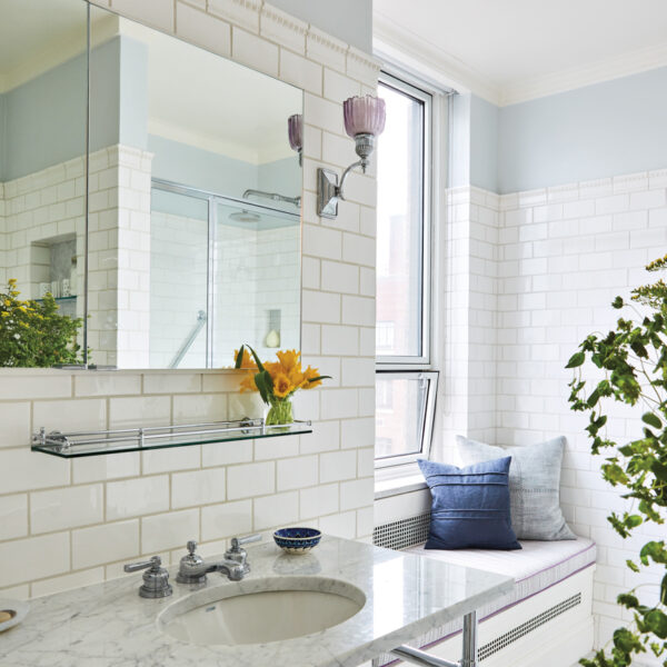 A Spunky Color Story Elevates A PreWar Duplex With Old New York Charm white bathroom with console sink and waterworks floor tile