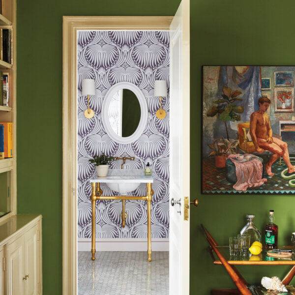 A Spunky Color Story Elevates A PreWar Duplex With Old New York Charm bar cart outside powder room with lotus wallcovering
