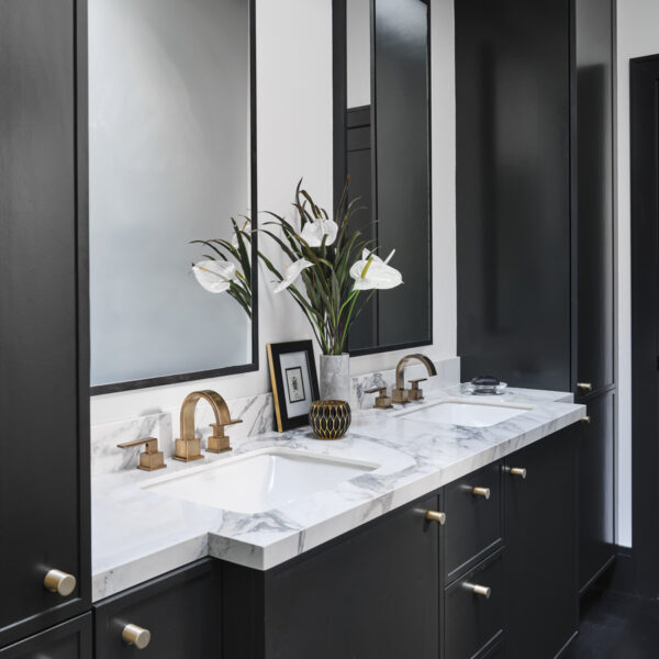 Deep Tones And Moody Wallpaper Add Drama To A Renovated Oregon Bungalow bronze and brass finishes master bathroom vanity