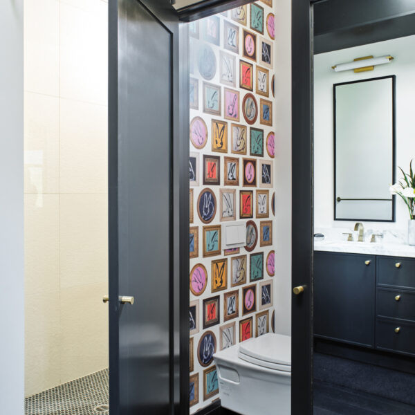 Deep Tones And Moody Wallpaper Add Drama To A Renovated Oregon Bungalow mirrored doors hide master bathroom toilet