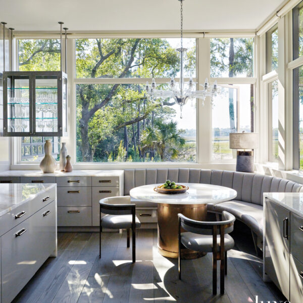 The South Carolina Lowcountry Retreat Perfect For Artists And Art Lovers kitchen banquette quarts and copper dining table