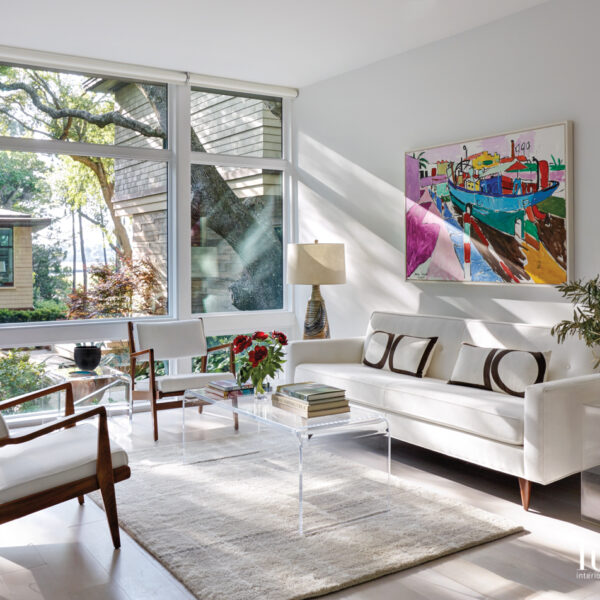 The South Carolina Lowcountry Retreat Perfect For Artists And Art Lovers living room with midcentury sofa and armchairs and jason berger painting